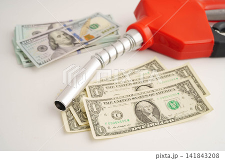 Gas pump, Fuel Nozzle with banknote money for cost energy. Gas pump, Fuel Nozzle with banknote money for cost energy. 141843208