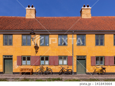 Yellow Historic Building with Bicycles in Copenhagen Denmark 141843664
