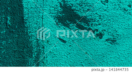 Weathered cyan stucco surface with dark stains and fine cracks. 141844735