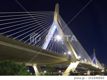 The Zakim Bridge illuminated at night with nice reflections in Boston, USA The Zakim Bridge illuminated at night with nice reflections in Boston, USA 141846660