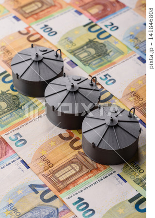 Oil tankers against the Euro money, concept of fuel supplies to Europe. Oil or liquefied gas tank Oil tankers against the Euro money, concept of fuel supplies to Europe. Oil or liquefied gas tank 141846808