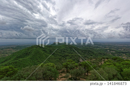 Dramatic Storm Clouds Over Green Mountain Forest Landscape Dramatic Storm Clouds Over Green Mountain Forest Landscape 141846873