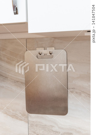Stainless Steel Cut Board Hang On Kitchen Wall Storage Utensils In Home Interior Stainless Steel Cut Board Hang On Kitchen Wall Storage Utensils In Home Interior 141847504