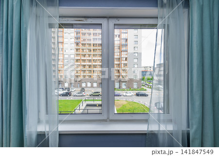 Bedroom window of residential apartment overlooking courtyard residential area Bedroom window of residential apartment overlooking courtyard residential area 141847549