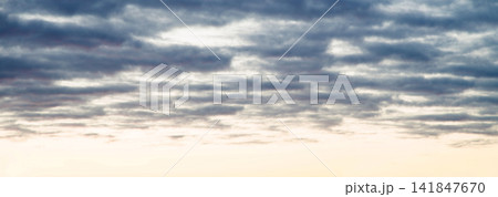Bright clouds in the evening sky 141847670