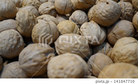 Whole walnuts in soft light emphasize natural organic textures, healthy snack concept 141847710