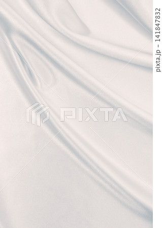 Smooth elegant grey silk or satin luxury cloth as wedding background. Luxurious background design Smooth elegant grey silk or satin luxury cloth as wedding background. Luxurious background design 141847832