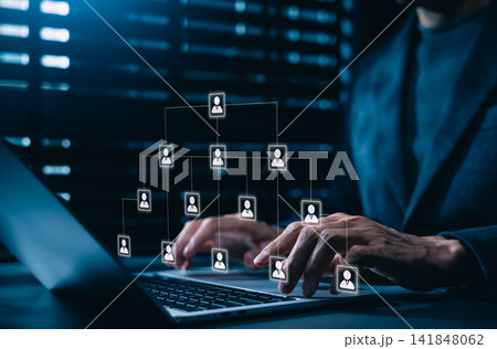 Corporate hierarchy chart and human resources structure concept. Business manager using laptop with corporate organizational scheme with people profile icons, digital team delegation network workflow. Corporate hierarchy chart and human resources structure concept. Business manager using laptop with corporate organizational scheme with people profile icons, digital team delegation network workflow. 141848062