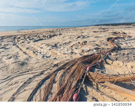 Traditional Arte Xavega fishing nets on sandy beach Traditional Arte Xavega fishing nets on sandy beach 141850034