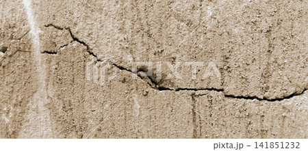 Cracked beige concrete wall texture background Cracked beige concrete wall texture background 141851232