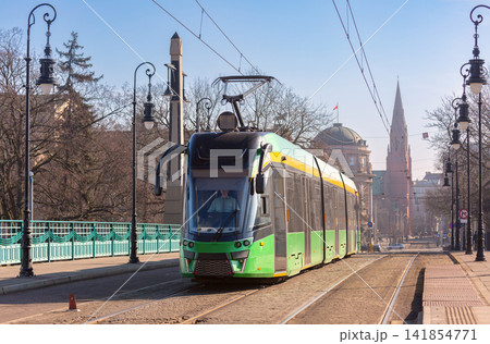 Modern Tram Crossing Historic Bridge in Poznan Poland 141854771