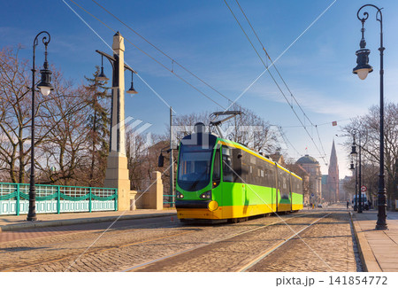 Modern Tram Crossing Historic Bridge in Poznan Poland 141854772