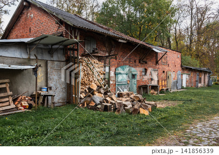 Old red brick outbuilding in a Russian village Old red brick outbuilding in a Russian village 141856339
