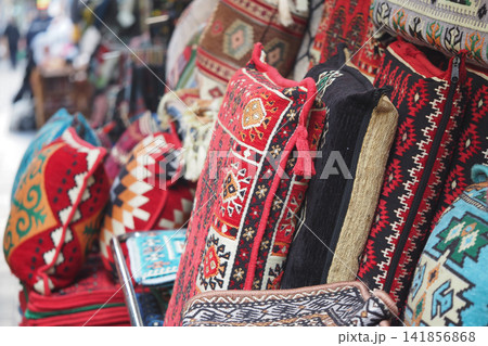 Colorful cushions displayed in a marketplace Colorful cushions displayed in a marketplace 141856868