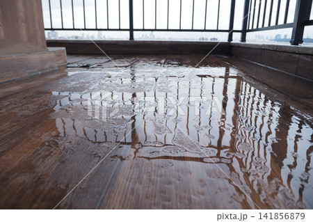 Wet balcony floor after rain on a cloudy day Wet balcony floor after rain on a cloudy day 141856879