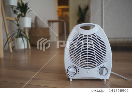 Home heater in living room on wooden floor Home heater in living room on wooden floor 141856902