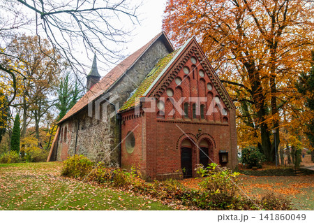 Historic Sinstorf Church in Hamburg Harburg surrounded by autumn foliage. Oldest building in Hamburg, Germany Historic Sinstorf Church in Hamburg Harburg surrounded by autumn foliage. Oldest building in Hamburg, Germany 141860049