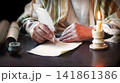 Male hand witn big quill 141861386