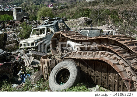 dump of old cars and machine parts. 141862227