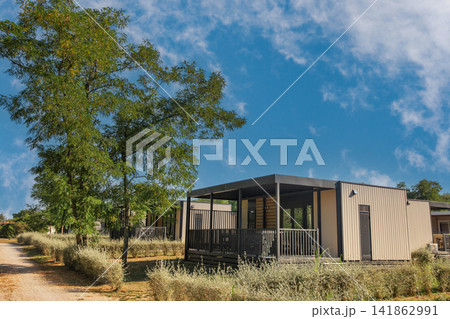 Modern mobile homes with covered porches at resort in Croatia. Modern mobile homes with covered porches at resort in Croatia. 141862991