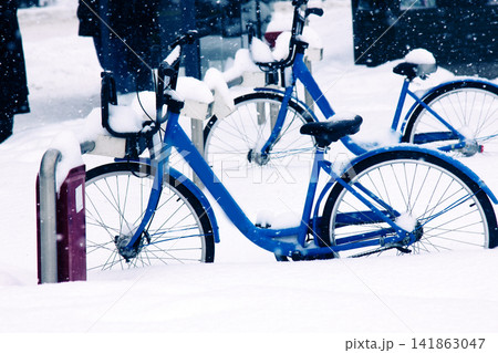 City bikes in the Parking lot covered with snow City bikes in the Parking lot covered with snow 141863047