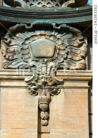 Architectural details on building, stone carving, aesthetic frills. Architectural details on building, stone carving, aesthetic frills. 141863562