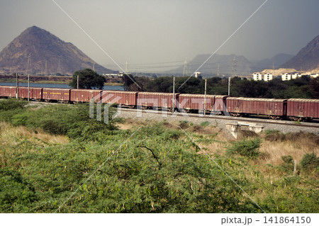 Freight train on background of picturesque Indian countryside 141864150