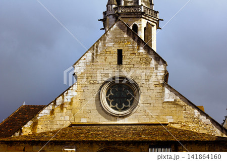 Temple pediment with round rose window and bell tower 141864160