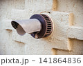 The exhaust pipe of a gas boiler of an autonomous heating system sticks out of the wall. 141864836