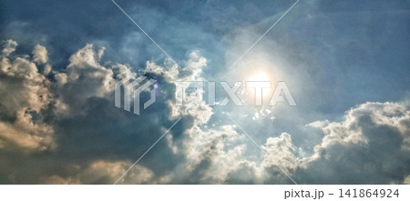Bright sun behind clouds with diffused light for a concept of hope Bright sun behind clouds with diffused light for a concept of hope 141864924