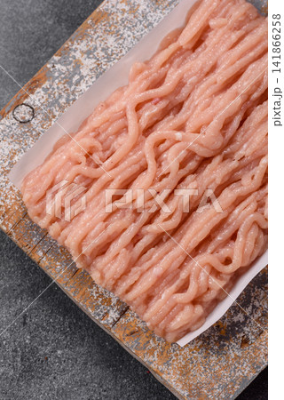 Fresh raw ground chicken, poultry meat for home cooking. Ground chicken Fresh raw ground chicken, poultry meat for home cooking. Ground chicken 141866258