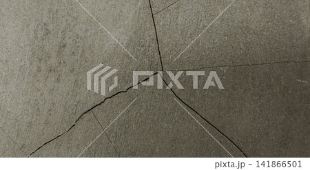 Cracked gray concrete surface texture 141866501