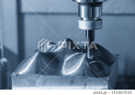 Rough cutting process on mold part using indexable ball nose end mill on CNC milling machine in light blue tone 141867010