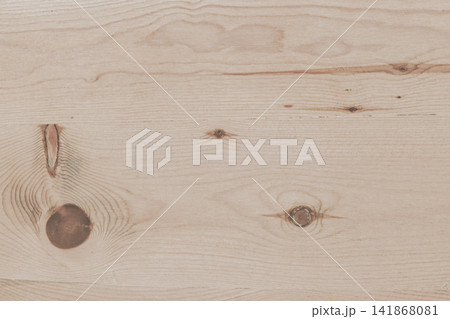 Light beige wooden texture background with smooth pine plank grain and subtle natural knots for modern Scandinavian interior design and minimalist surface concept Light beige wooden texture background with smooth pine plank grain and subtle natural knots for modern Scandinavian interior design and minimalist surface concept 141868081