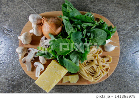 Fresh Homemade Pasta Ingredients with Mushrooms Vegetables and Cheese 141868979