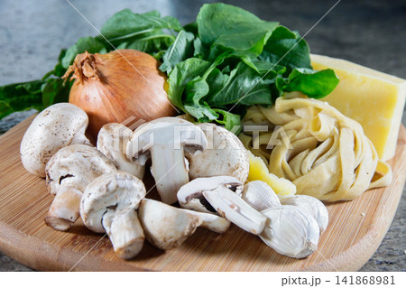 Fresh Homemade Pasta Ingredients with Mushrooms and Greens Fresh Homemade Pasta Ingredients with Mushrooms and Greens 141868981