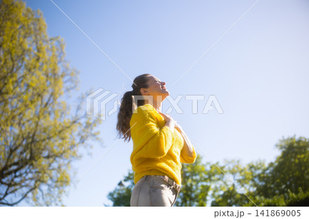 Reflective Woman Finding Spring Serenity Reflective Woman Finding Spring Serenity 141869005