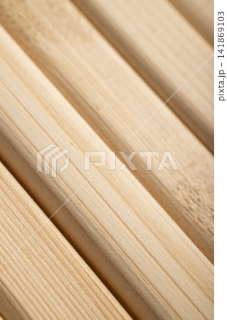 Diagonal slats made of natural wood in warm color 141869103