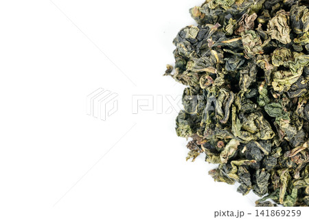 Green oolong tea closeup with white backdrop 141869259