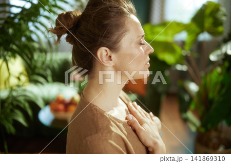 Mindful Woman Resting Hands on Chest for Inner Calm 141869310