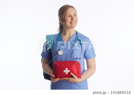 Medical Student with First Aid Kit Looking Aside Smiling 141869518