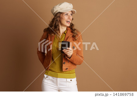 Stylish Woman Engaged with Smartphone Stylish Woman Engaged with Smartphone 141869758