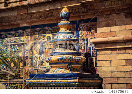 Close up of colorful ceramic tile column head capital at Plaza of Spain in Seville Close up of colorful ceramic tile column head capital at Plaza of Spain in Seville 141870682