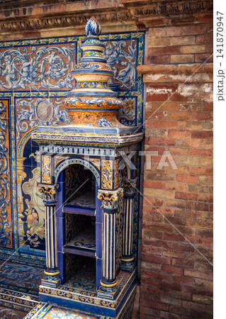 Vertical view of decorative ceramic tile column between provincial bench alcoves at Plaza of Spain in Seville Vertical view of decorative ceramic tile column between provincial bench alcoves at Plaza of Spain in Seville 141870947