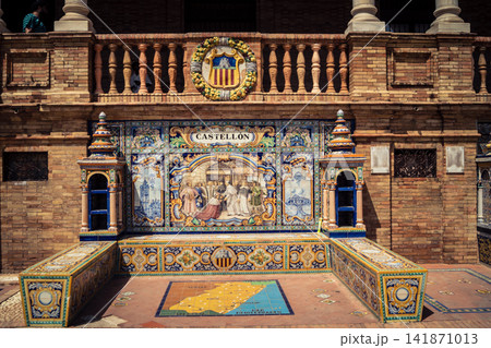 General view of ceramic tile bench alcove with coat of arms at Plaza of Spain in Seville General view of ceramic tile bench alcove with coat of arms at Plaza of Spain in Seville 141871013