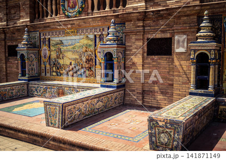 General view of ceramic tile bench alcove with coat of arms at Plaza of Spain in Seville General view of ceramic tile bench alcove with coat of arms at Plaza of Spain in Seville 141871149