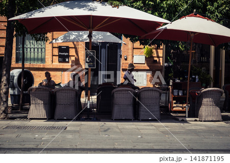 Spanish tapas bars and restaurant outdoor terraces on Calle San Fernando in Seville Spanish tapas bars and restaurant outdoor terraces on Calle San Fernando in Seville 141871195