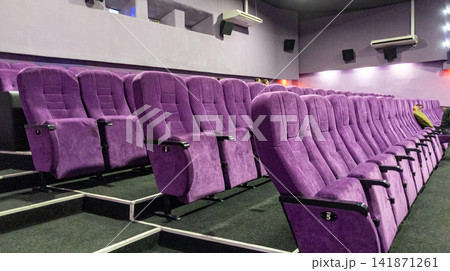 Cinema Hall Purple Velvet Seats in Rows Inside Empty Movie Theater Auditorium 141871261