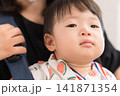 抱っこ紐でお祭りに参加するスイカ柄甚平の日本人の男の赤ちゃん 抱っこ紐でお祭りに参加するスイカ柄甚平の日本人の男の赤ちゃん 141871354