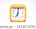 Yellow Retro Alarm Clock Showing 07:00 Time Isolated on Background Vintage Timepiece 141871456